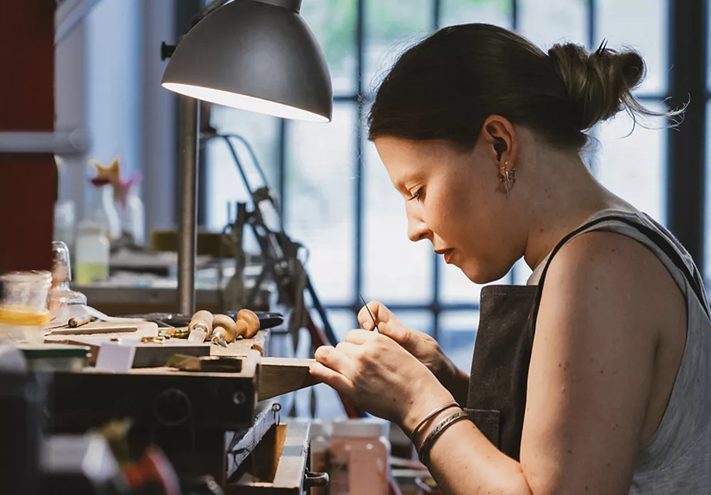 Jeweller working at the bench